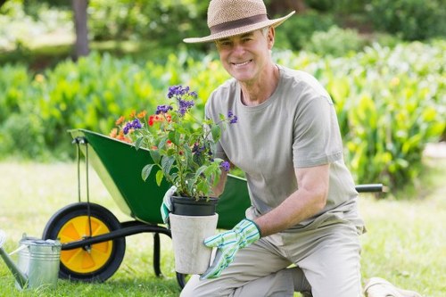 Local gardener tending to a residential lawn in St Johns Wood